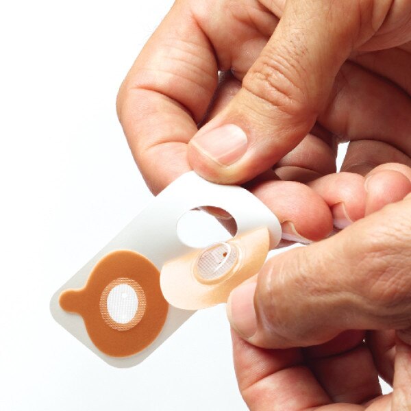 Man Peeling Provent off Packaging